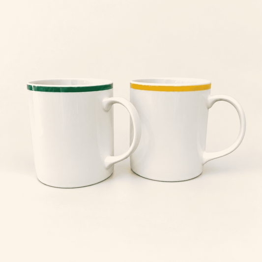Pair of vintage Japanese ceramic mugs with yellow and green rims