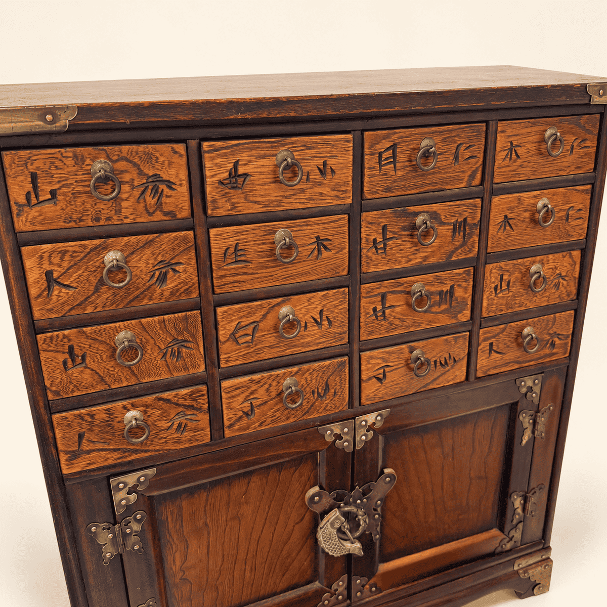 Korean apothecary chest, angled view showing winged top and brass corner mounts