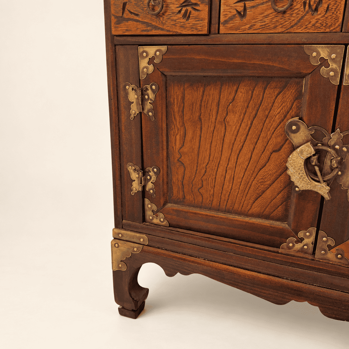 Lower cupboard doors with brass butterfly hinges and fish lock on Korean medicine chest