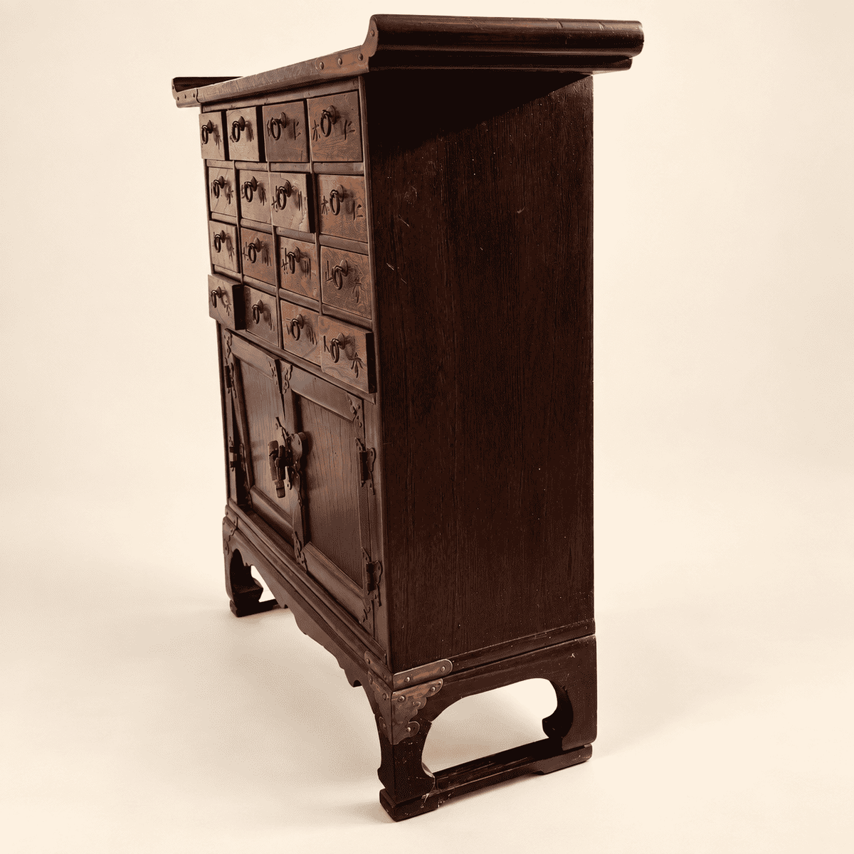 Side profile of Korean apothecary chest showing depth and bracket base