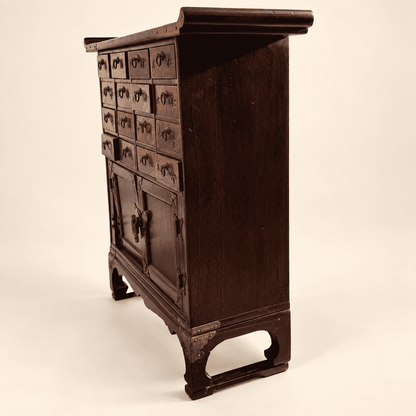 Side profile of Korean apothecary chest showing depth and bracket base