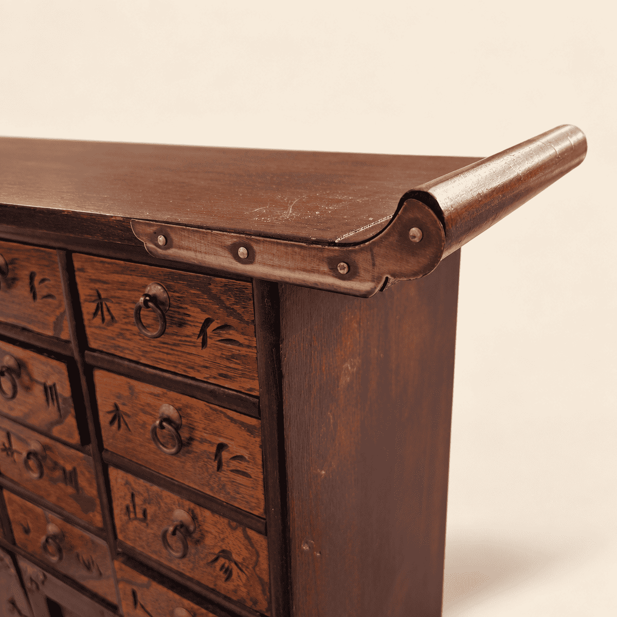 Detail of winged top edge and brass corner mount on Korean medicine chest