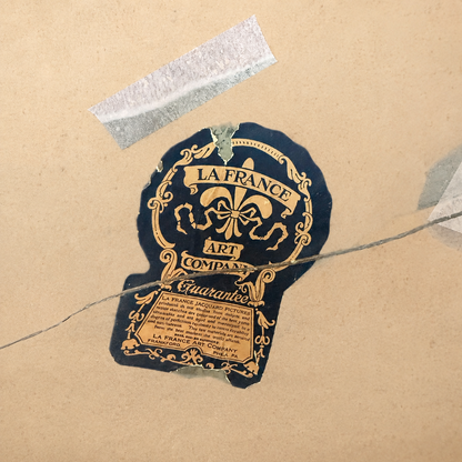 Original La France Art Company paper label on the back of the antique tapestry mirror