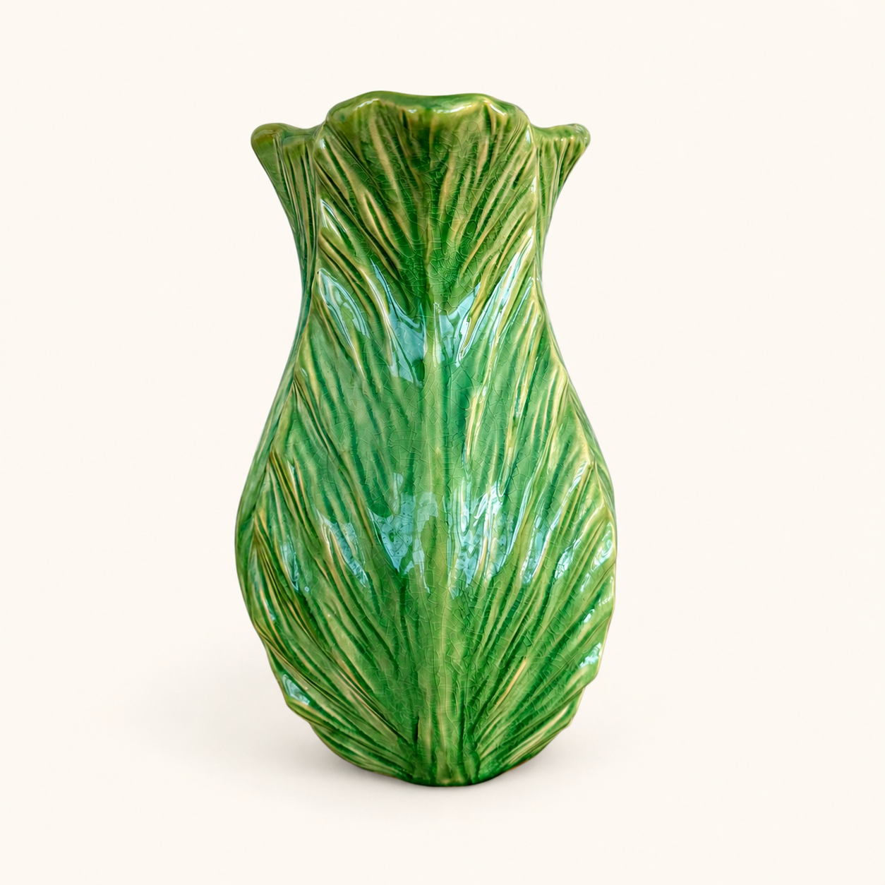 Back view of green majolica leaf pitcher showing veined cabbage leaves