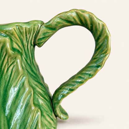 Detail of twisted vine handle on green majolica cabbage pitcher
