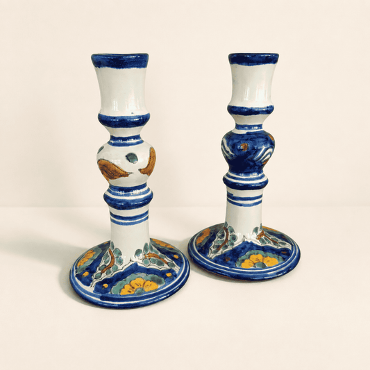 Pair of Mexican Talavera-style candlesticks with cobalt blue bands and floral bases, front view