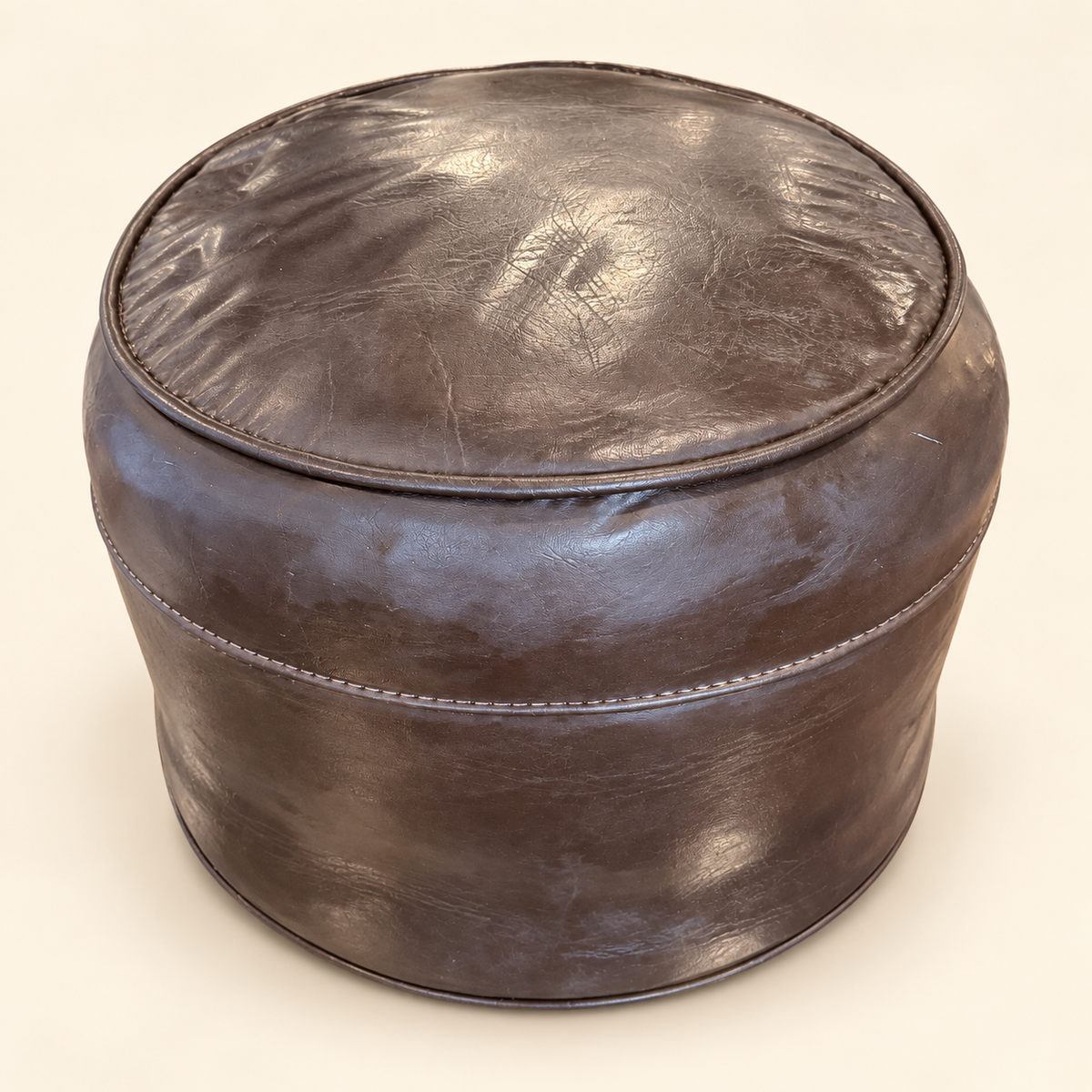 Chocolate brown vinyl hassock footstool, side view