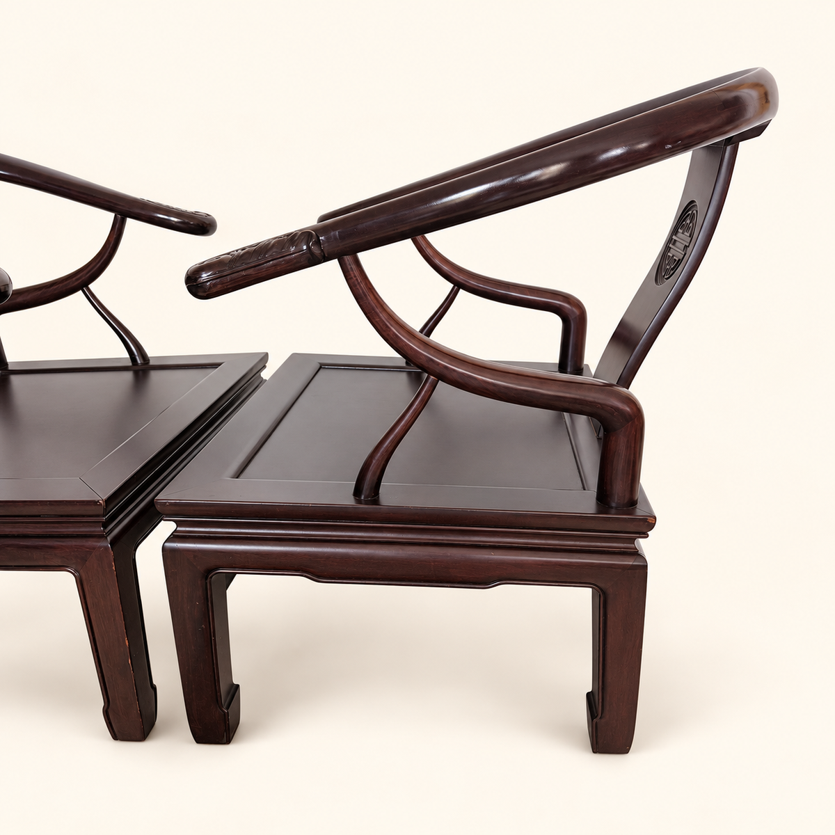 Sculptural arm of a Ming-style horseshoe lounge chair
