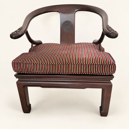 Curved horseshoe back and arms of a Chinese lounge chair