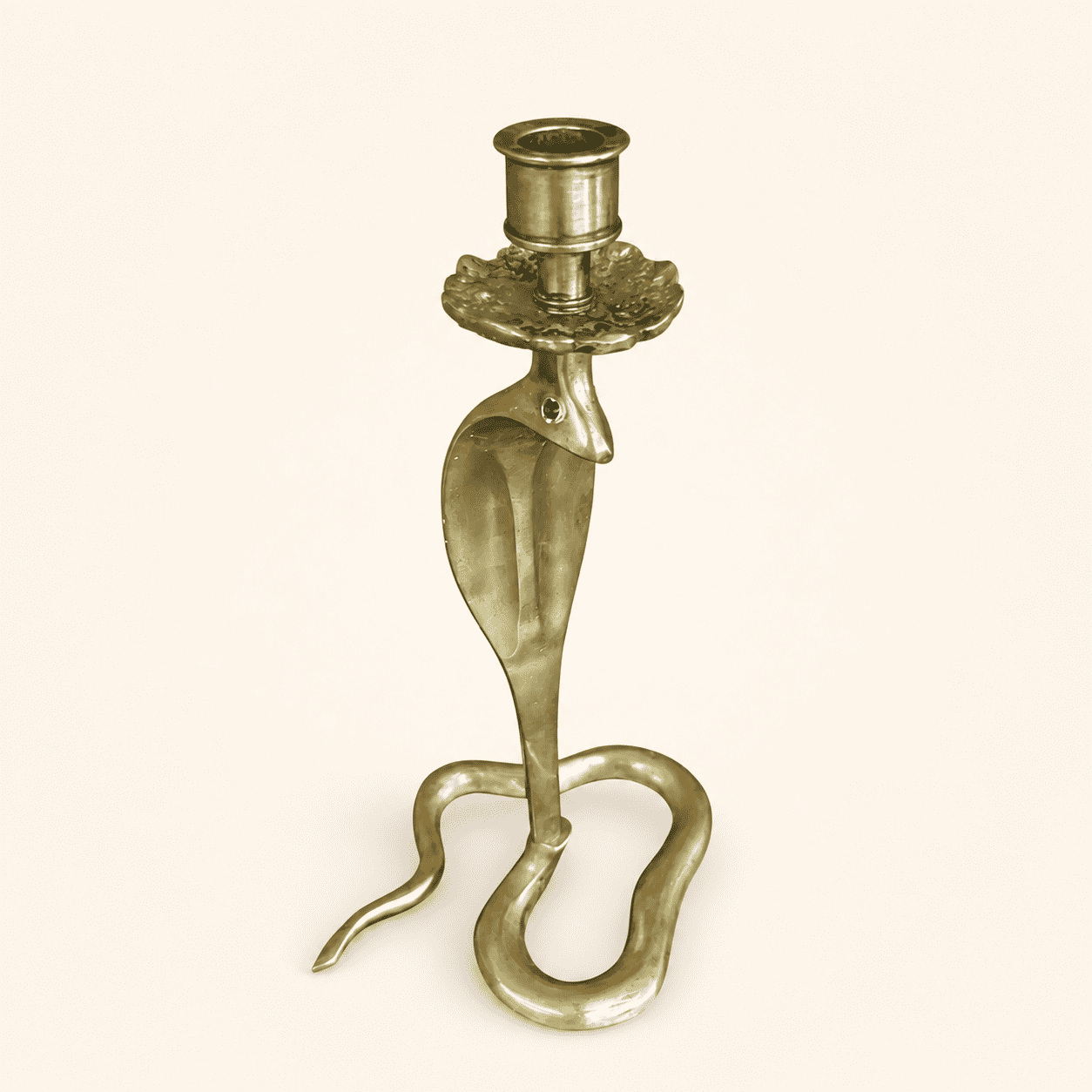 Full front view of handcrafted brass cobra candlestick with green glass eyes