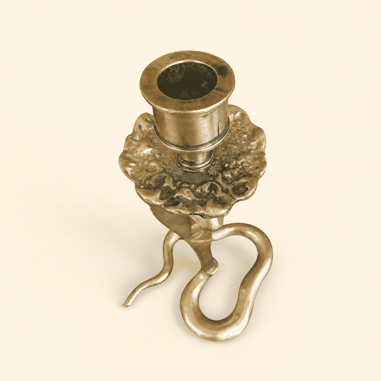 Top-down view of cobra candlestick showing ruffled bobeche and candle cup