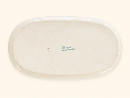 Green maple leaf Nippon backstamp on the underside of an antique porcelain dish