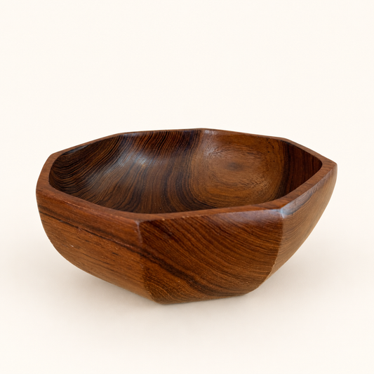 Octagonal teak wood bowl in Danish modern style, angled view showing faceted sides