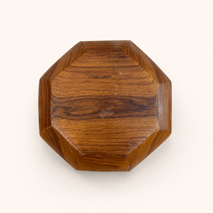 Bottom of octagonal teak bowl showing staved construction