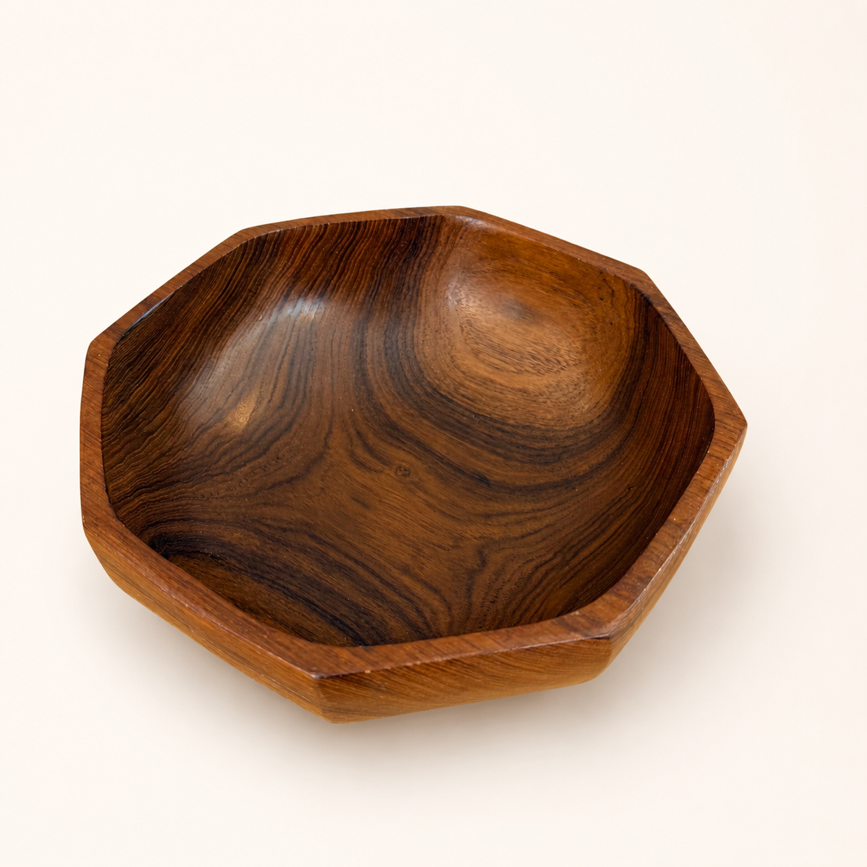Interior of vintage teak bowl showing swirling grain