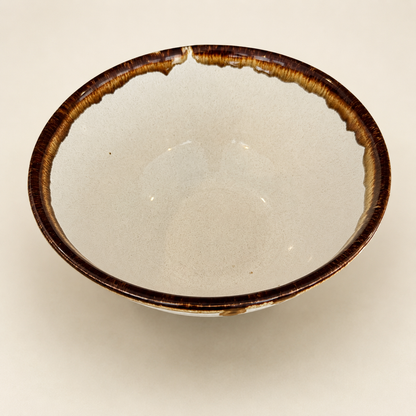 Interior of Pfaltzgraff Country Casual bowl showing speckled cream glaze