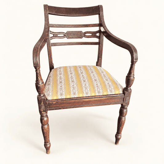 Regency-style mahogany carver armchair, front view with gold floral drop-in seat