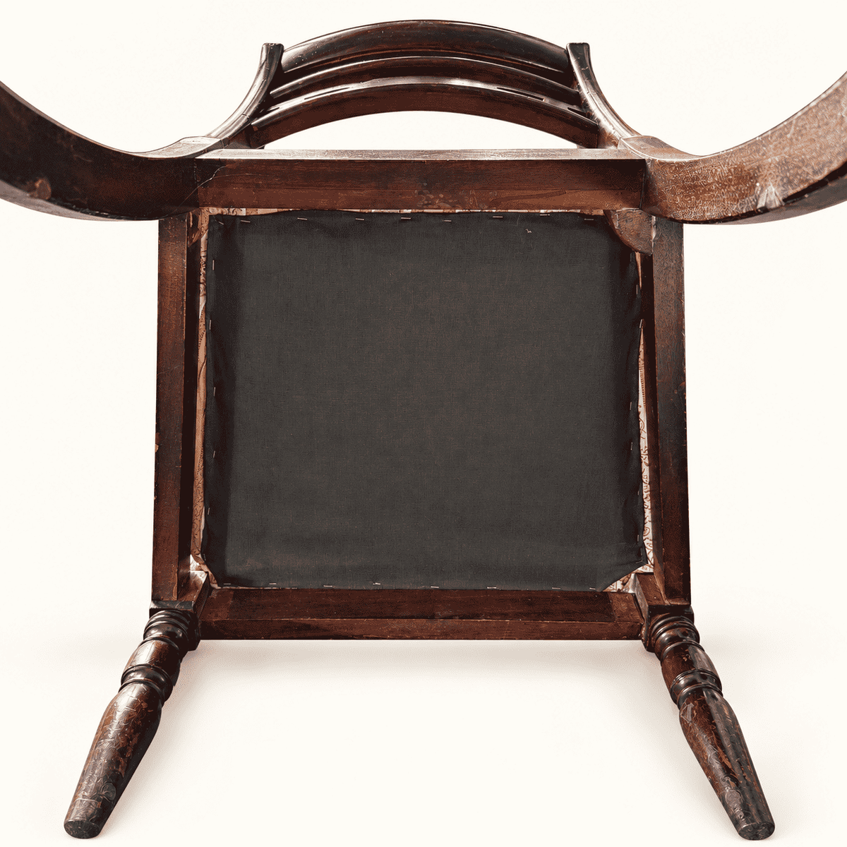 Underside of the seat with black cambric and the mahogany frame