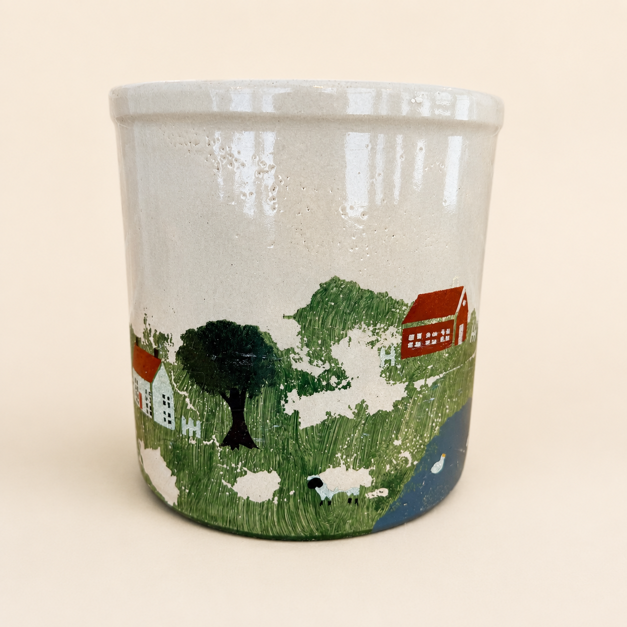 Painted barn and tree folk art on vintage crock