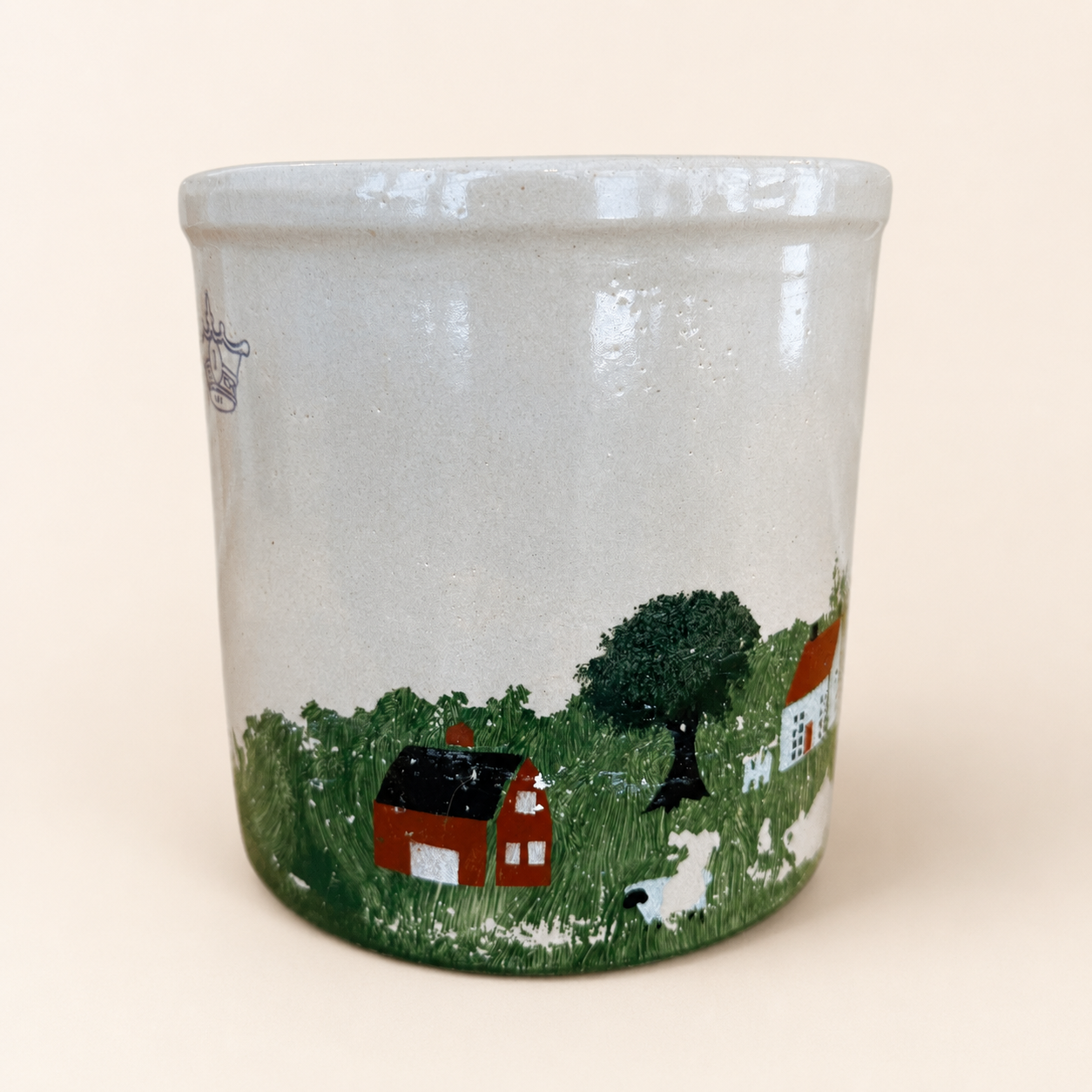 Red barn and sheep detail on hand-painted crock