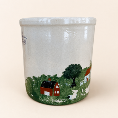 Red barn and sheep detail on hand-painted crock