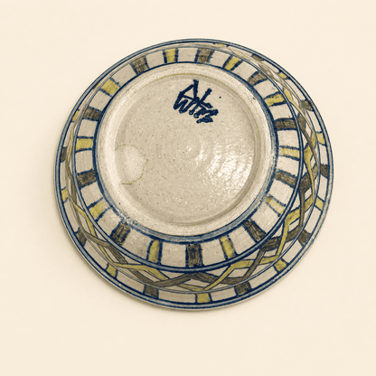 Base of studio pottery bowl showing blue painted artist's signature