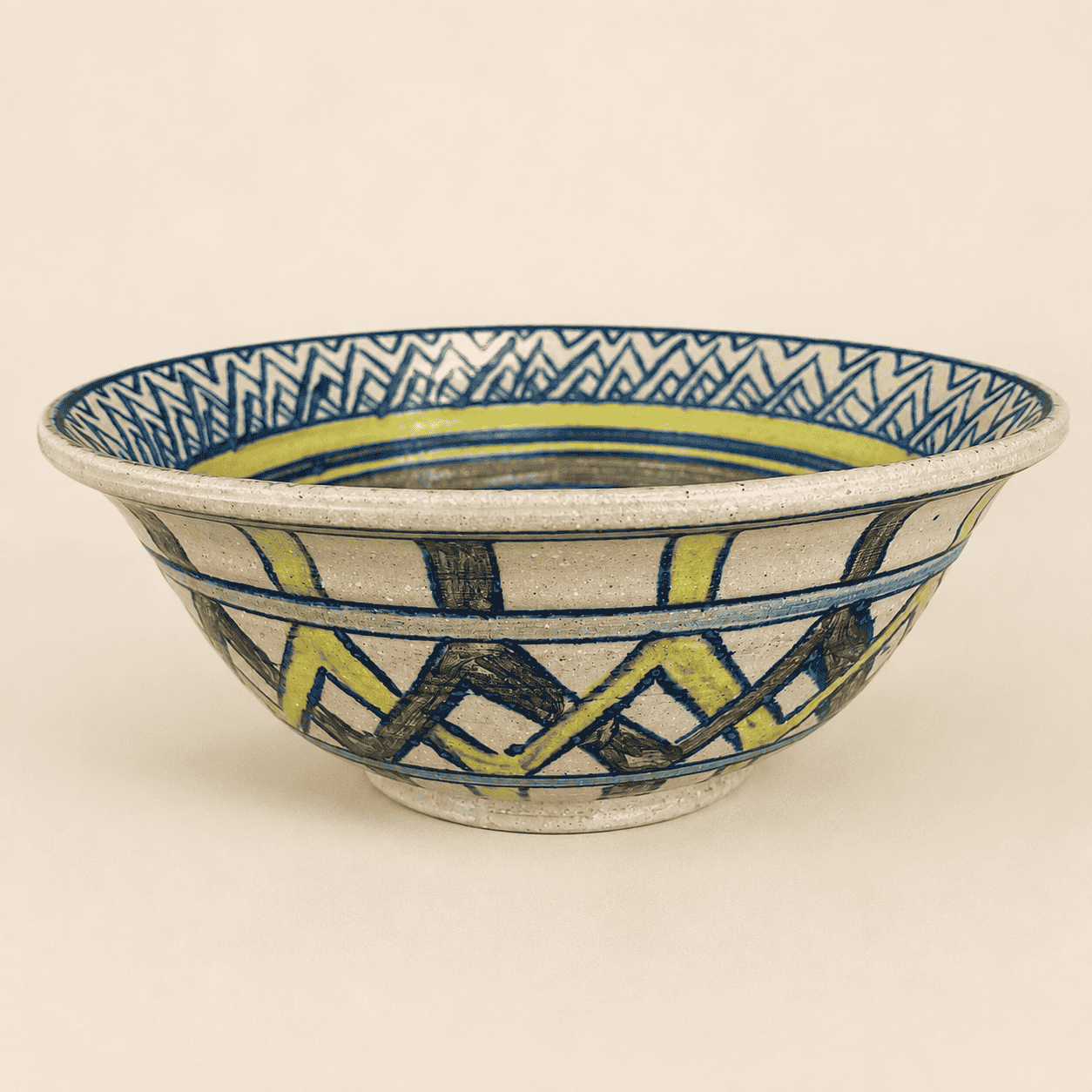 Side profile of hand-thrown studio pottery bowl with painted geometric bands