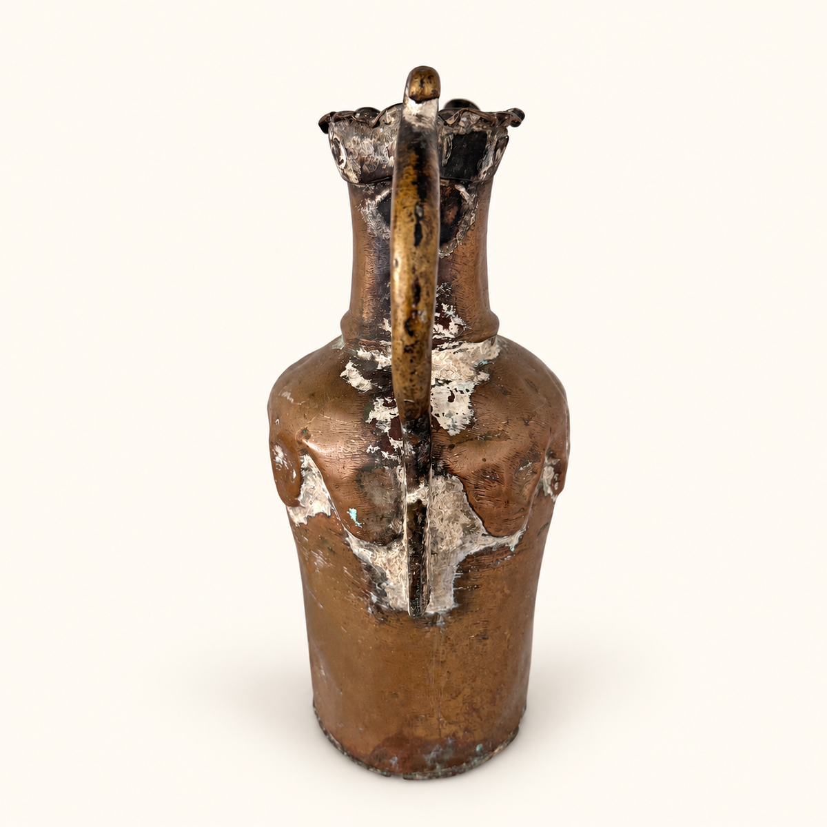 Back of the ewer with the handle running down the center and the crimped rim above