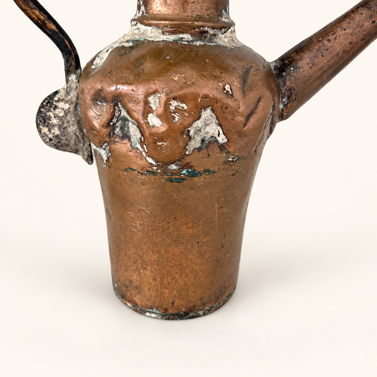 Hammered copper body and the dovetailed spout join, worn tin wash and hammer marks in close detail