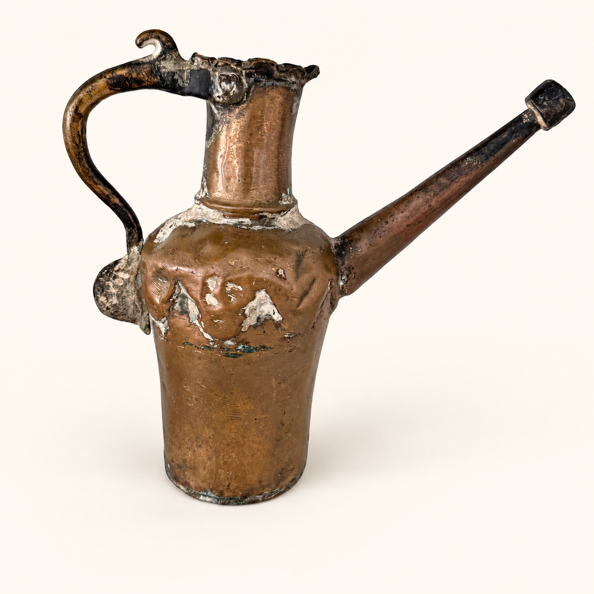 Antique hand-forged tinned copper ewer, front view with a long straight spout and high arched handle