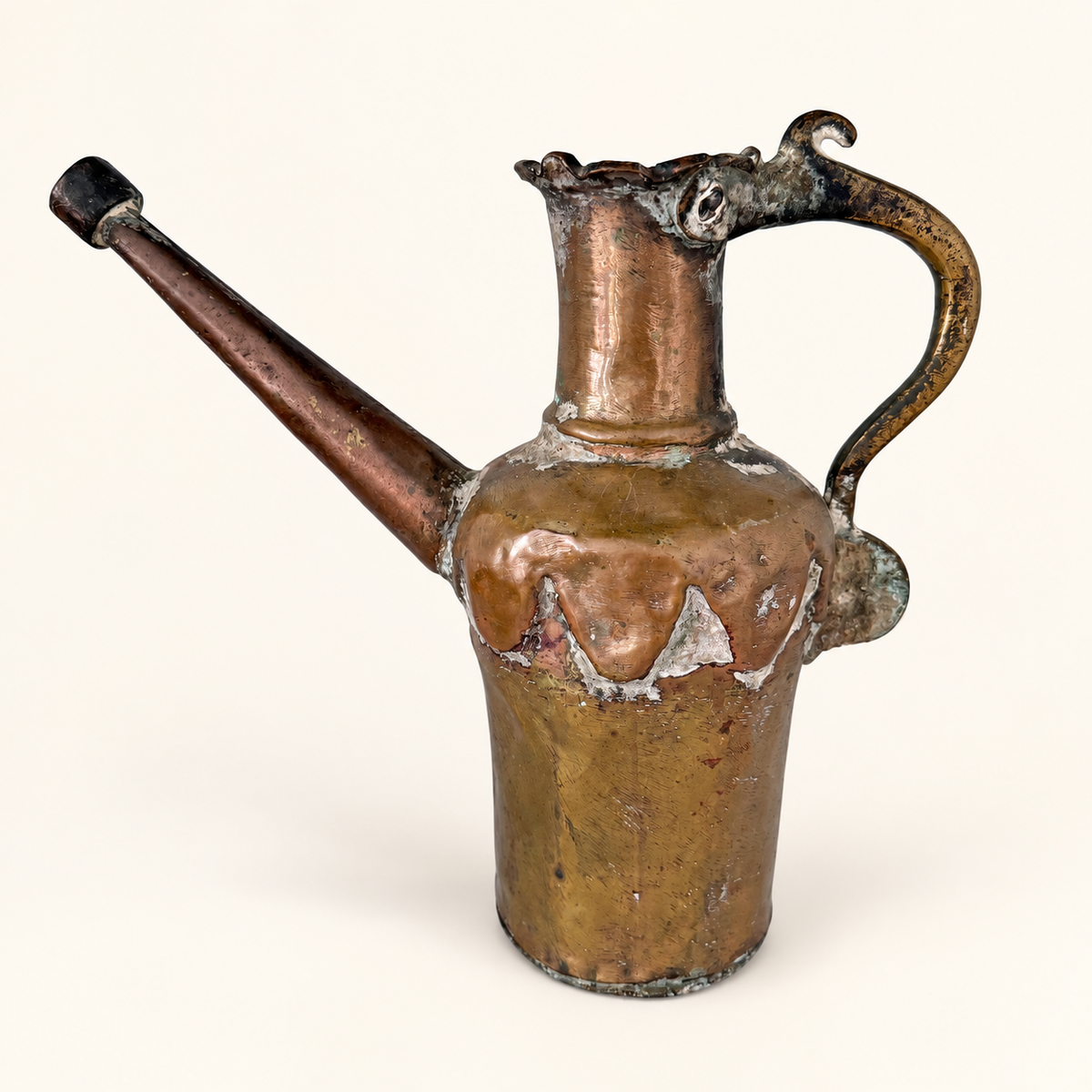The tinned copper ewer from the other side, spout to the left and handle to the right