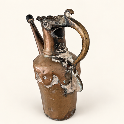 Three-quarter view of the ewer showing the handle, spout, and shouldered body