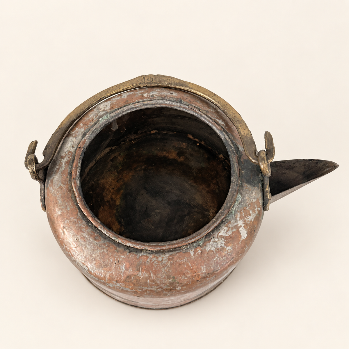 Kettle with the lid off, looking down into the open interior, spout to the right
