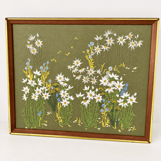 Vintage 1970s crewel embroidery of wildflower meadow with daisies and cornflowers on olive green, framed, photo 1 of 5