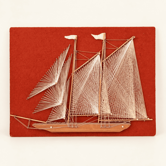 Vintage 1970s string art schooner sailboat on red felt board, front view, photo 1 of 5