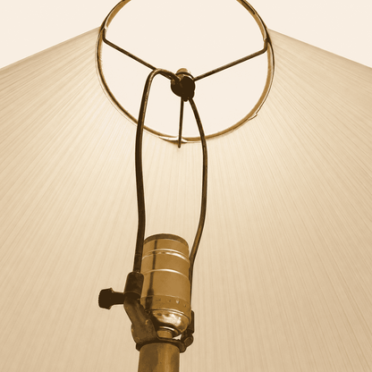 Detail of the sculptural twisted brass column and base