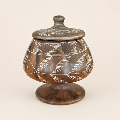 Vintage carved soapstone lidded jar with etched fish and leaf design, front view