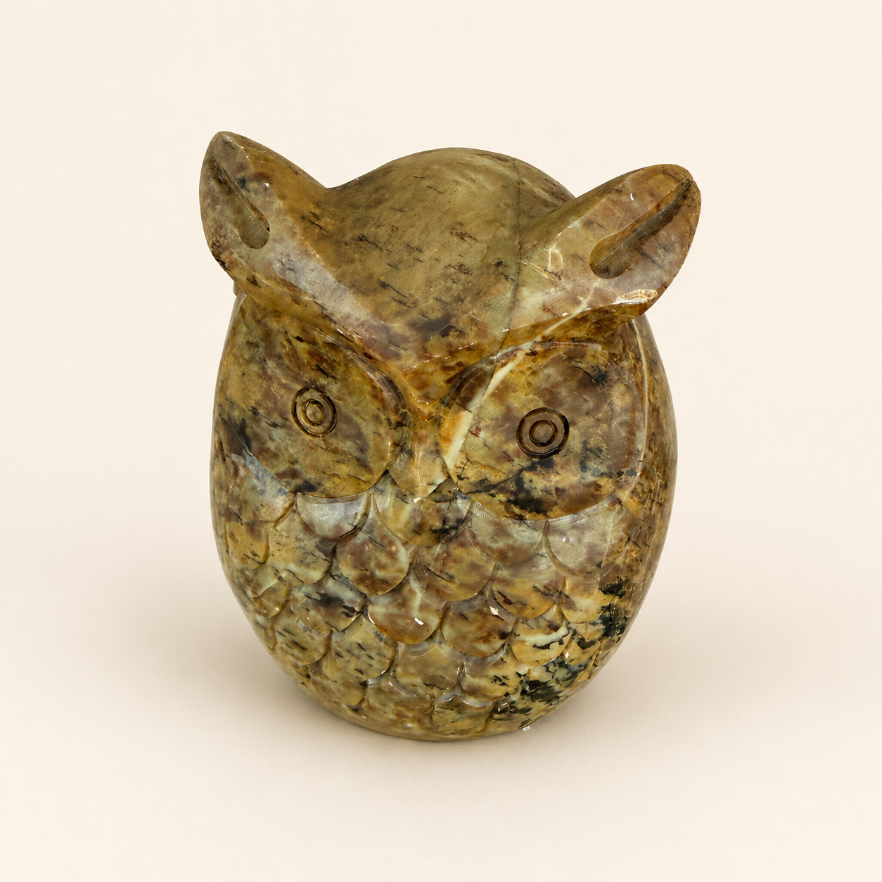 Side profile of vintage carved stone owl figurine