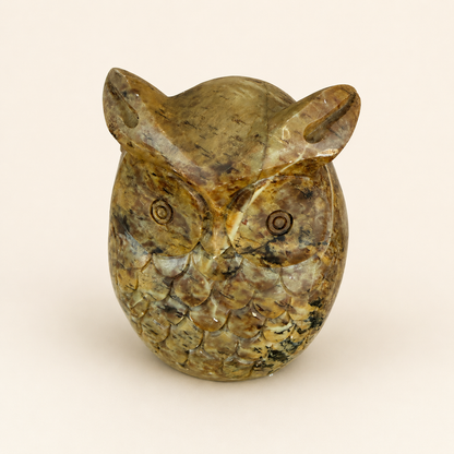 Side profile of vintage carved stone owl figurine