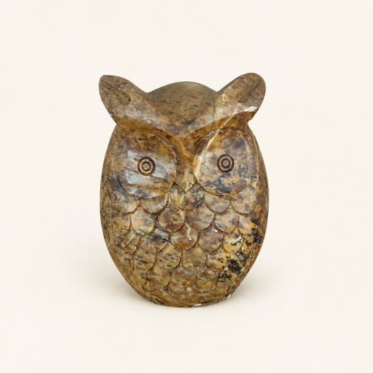 Vintage hand-carved stone owl figurine with tufted ears and incised eyes, front view