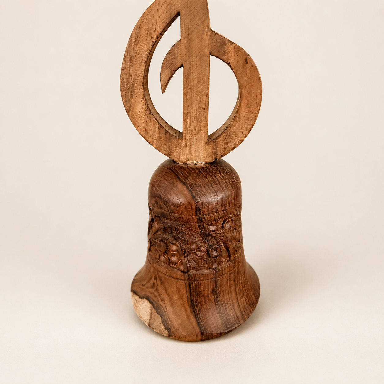 Detail of carved floral band on wooden hand bell
