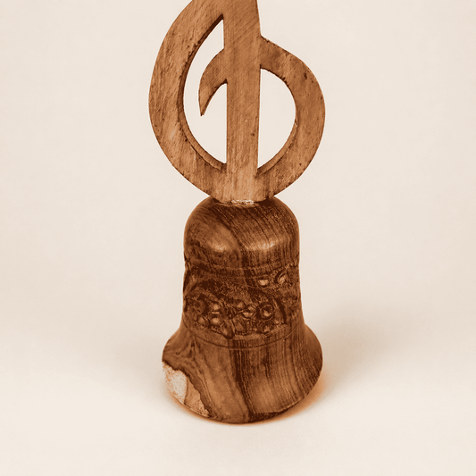 Detail of carved floral band on wooden hand bell