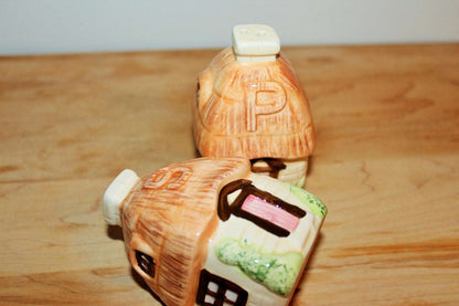 Vintage ceramic cottage salt and pepper shakers with peach thatched roofs, photo 10 of 10