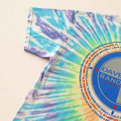 Back left sleeve of 2001 Dave Matthews Band tie-dye tee showing circular tour date print
