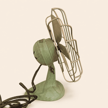 Worn original cloth-wrapped cord on the vintage Faultless fan