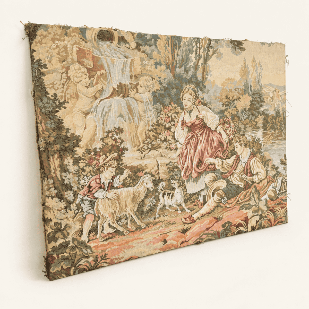 Vintage French Rococo jacquard tapestry with a shepherdess, flute player, boy with sheep and cherub fountain, angled view