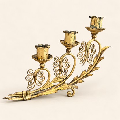 Gilded three-arm candelabra, side view showing scrollwork and worn gilt patina
