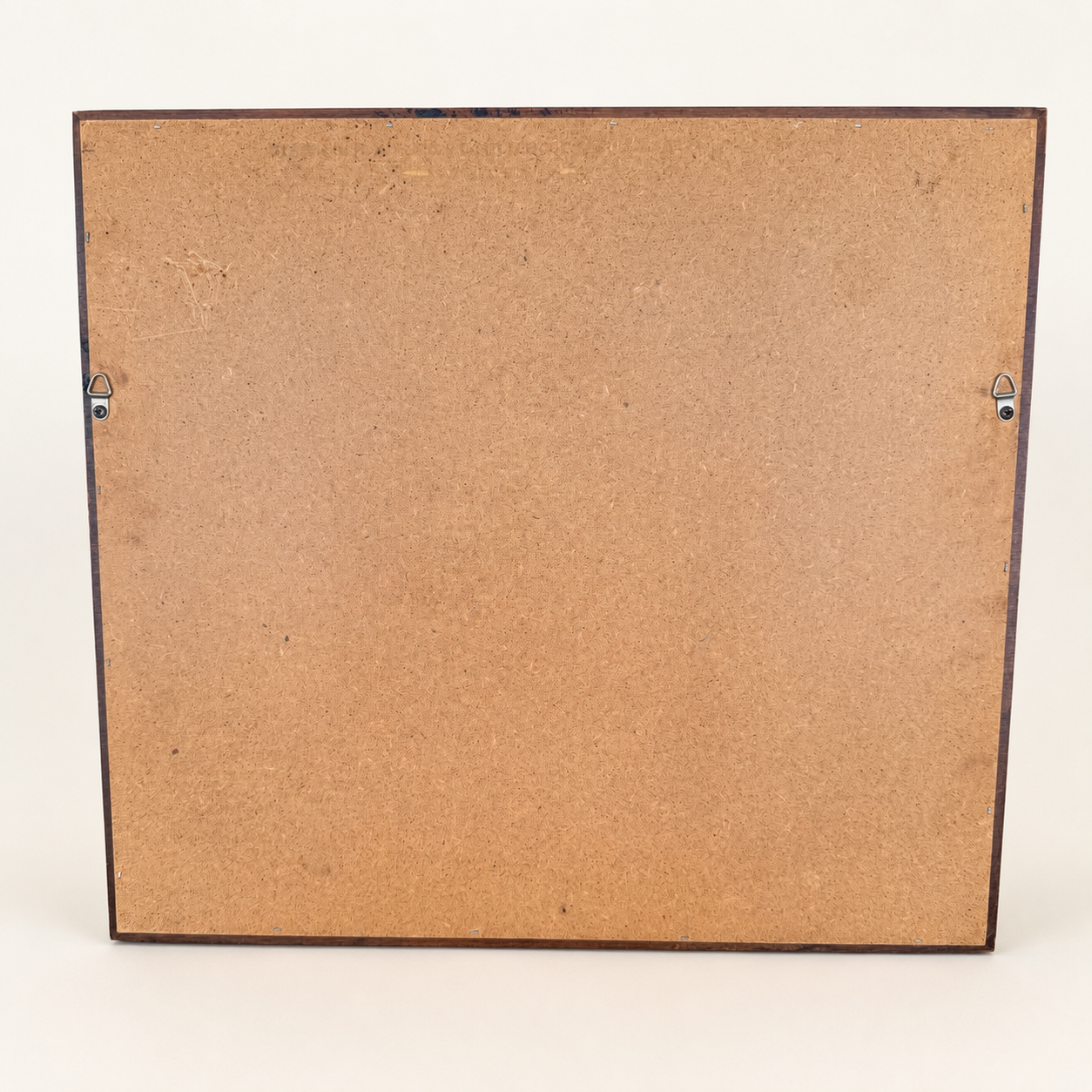 Back of Hitchcock mirror showing hardboard panel and wire hangers