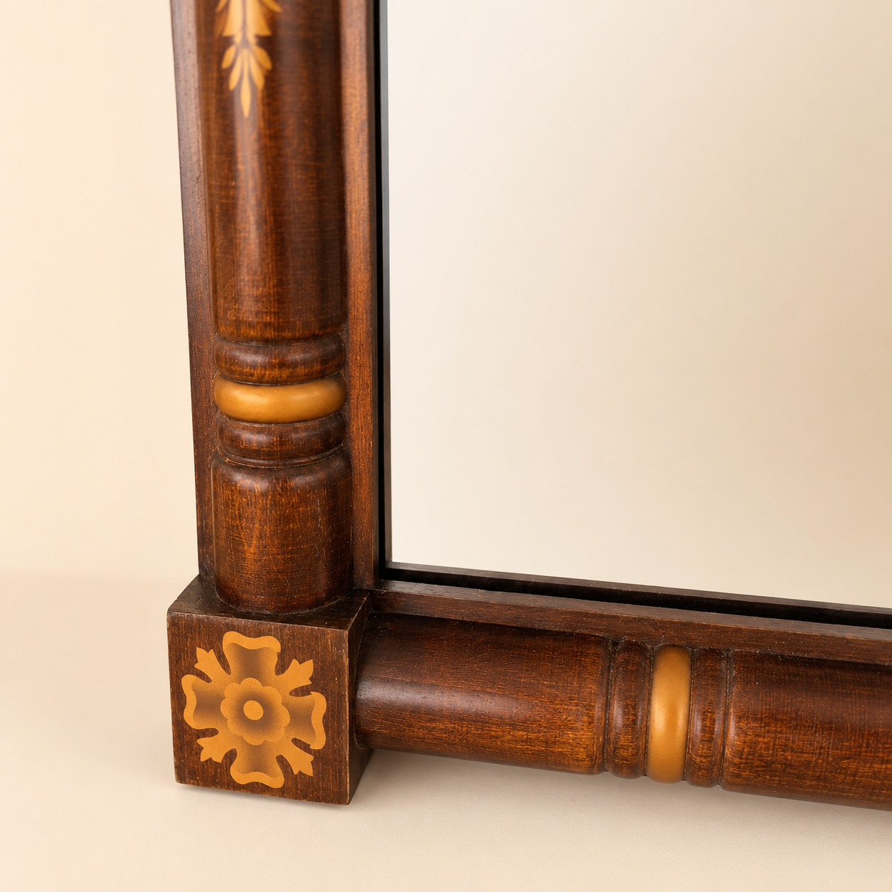 Lower corner detail of Hitchcock mirror with rosette and ring-turned column