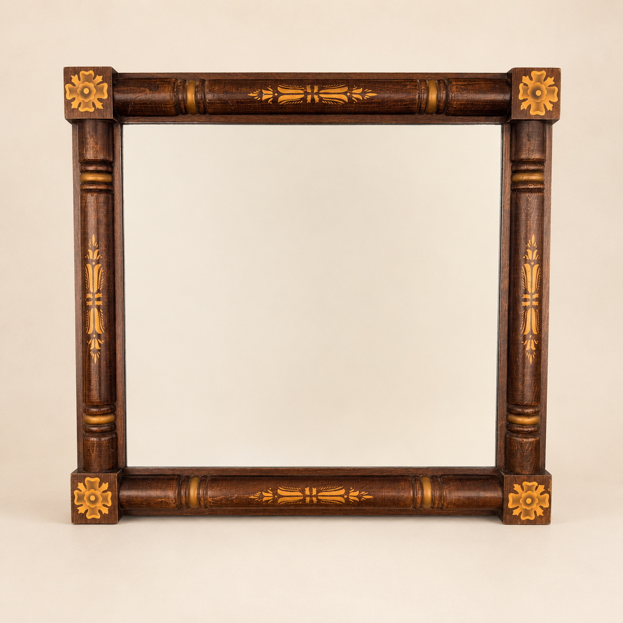 Vintage Hitchcock stenciled wall mirror with turned columns and gold rosettes, front view